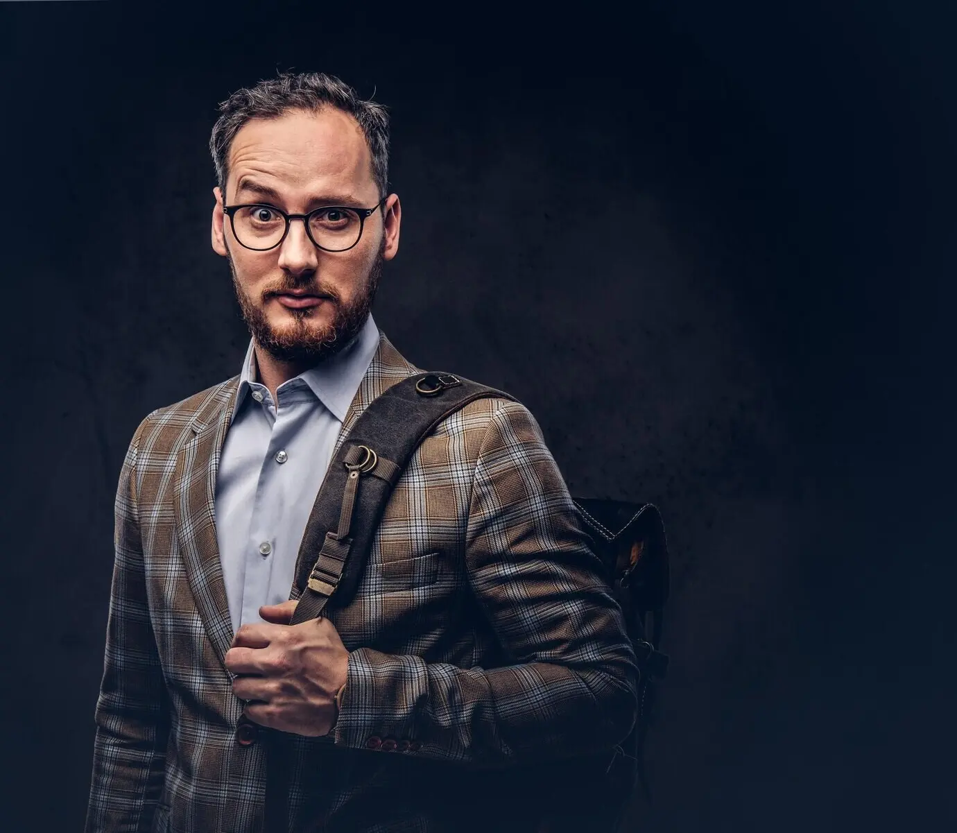 Traveler. Studio shot of a good-looking bearded man wearing a ca